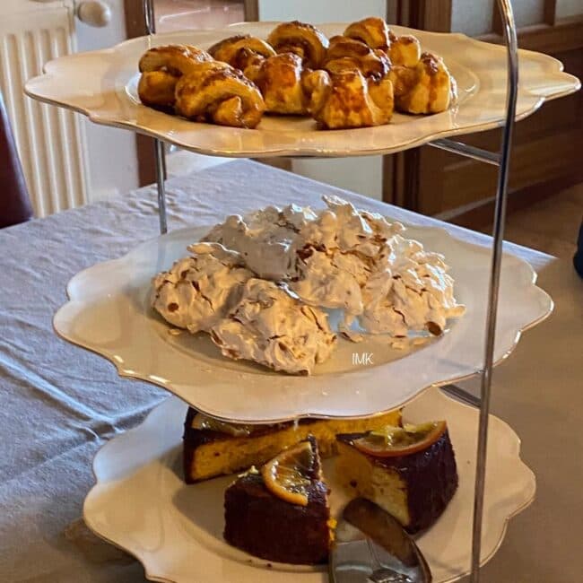 Tiered cake stand with pastries and cakes