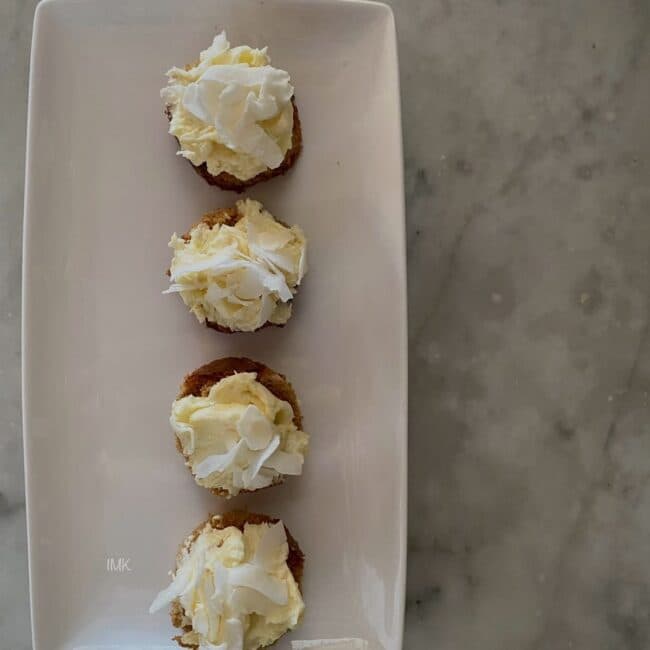 Petite canapés topped with whipped cheese